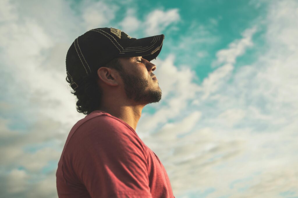 pexels-photo-810775-810775 Man practicing mindfulness and deep breathing exercises outdoors for stress relief