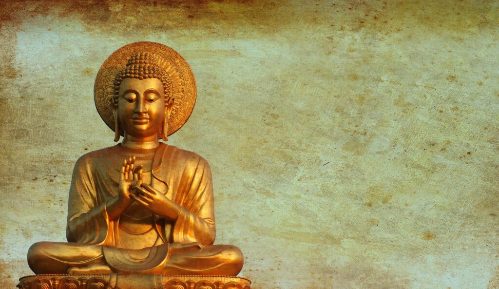 A serene golden Buddha statue symbolizing peace, representing the core concept of modern idolatry and the search for true meaning beyond external forms.
