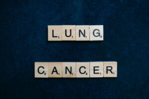Scrabble tiles spelling lung cancer on dark background symbolizing awareness. Understanding the full health effects of tobacco smoking is critical, as the damage extends far beyond the lungs to impact your brain, heart, and digestive system. Scrabble tiles spelling lung cancer on dark background symbolizing awareness.