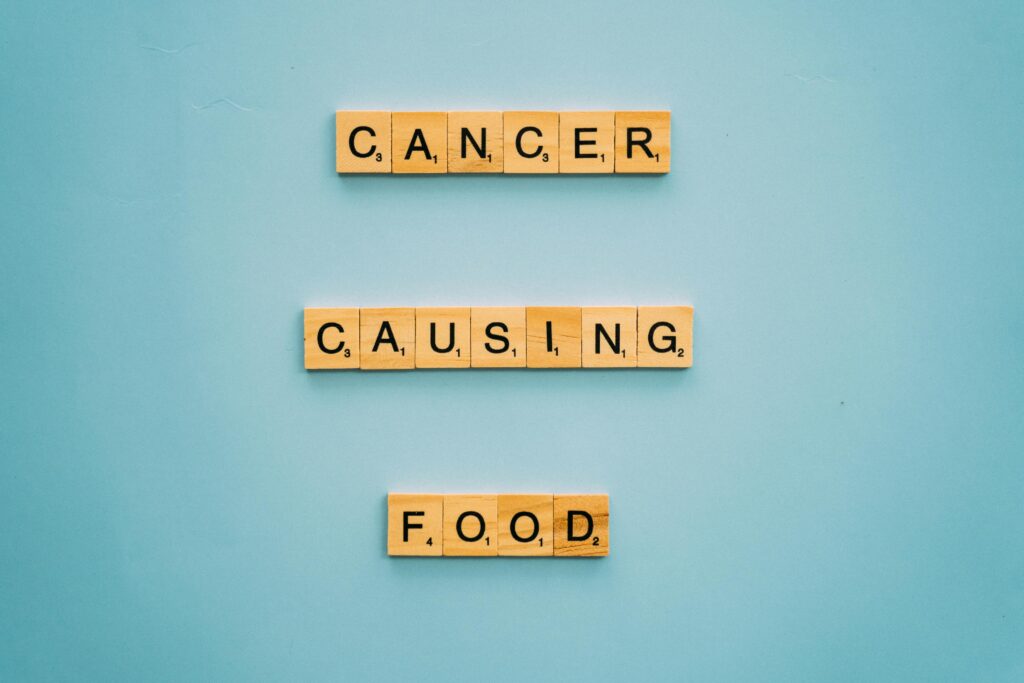 pexels-photo-8428398-8428398 Scrabble tiles spelling cancer causing food next to the key for natural cancer treatment.