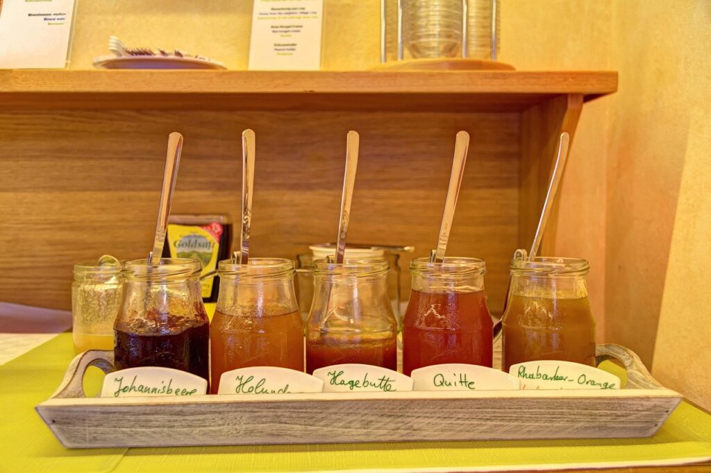 While seemingly natural, jams and jellies are typically high in added sugars, contributing to the daily intake of problematic glucose. Homemade jam with high glucose content showing refined sugar health problems