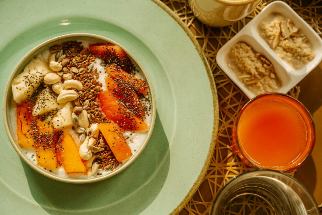 A nourishing vegetarian breakfast that reflects the true benefits of a vegetarian diet — supporting better digestion, balanced energy, and a naturally healthier lifestyle. A vibrant vegetarian breakfast bowl with yogurt, fruits, and seeds illustrating the benefits of a vegetarian diet for improved digestion, energy, and overall wellness.
