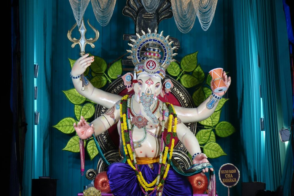 In Hinduism, deities like Lord Ganesha have historical ties to cannabis. Ancient texts and rituals, such as those dedicated to Shiva, the 'Lord of Bhang,' describe its use as a sacred offering to alleviate suffering and connect with the divine, a practice that predates modern prohibition by thousands of years. Colorful statue of the Hindu deity Lord Ganesha, who is associated with cannabis in ancient Hindu rituals and mythology.