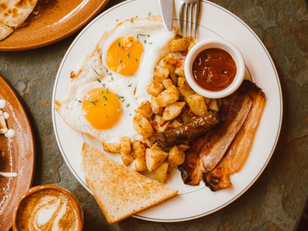 While a classic breakfast, meals high in animal products like eggs and bacon are acid-forming in the body, contributing to the toxic load that is the true root cause of disease. 