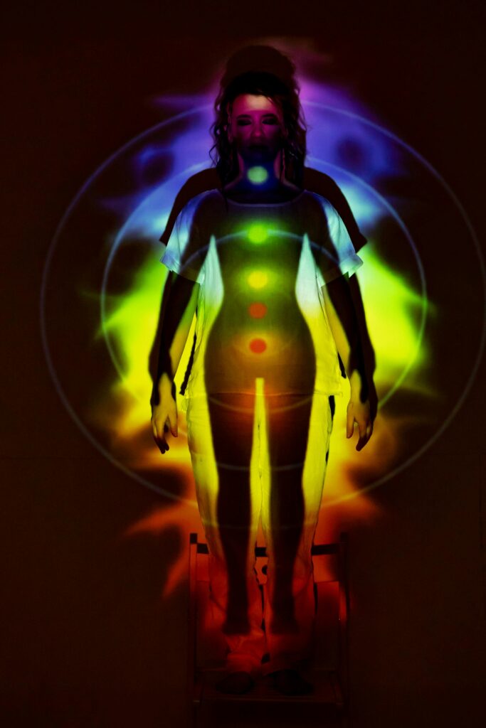 This powerful visualization shows the human chakra system in a state of perfect balance and activation, with energy flowing freely from the root to the crown chakra during meditation. A visual representation of the human chakra system, showing a meditating silhouette with seven vibrant energy centers aligned along the spine, symbolizing spiritual balance and energy flow.