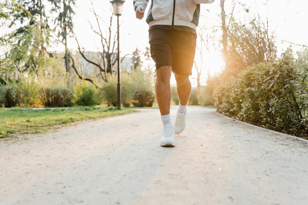 Health for Success begins with daily discipline—physical energy fuels focus, creativity, and the drive to achieve lasting goals. Motivated professional jogging at sunrise symbolizing Health for Success and the connection between fitness and achievement.
